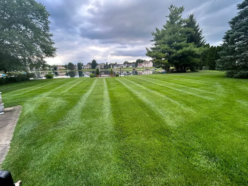 Freshly mowed lawn overlooking a neighborhood pond